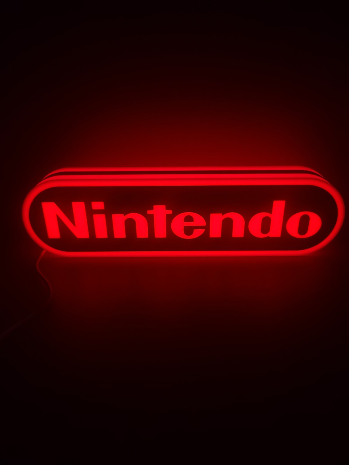 Nintendo LED light sign with illuminated logo viewed from straight on
