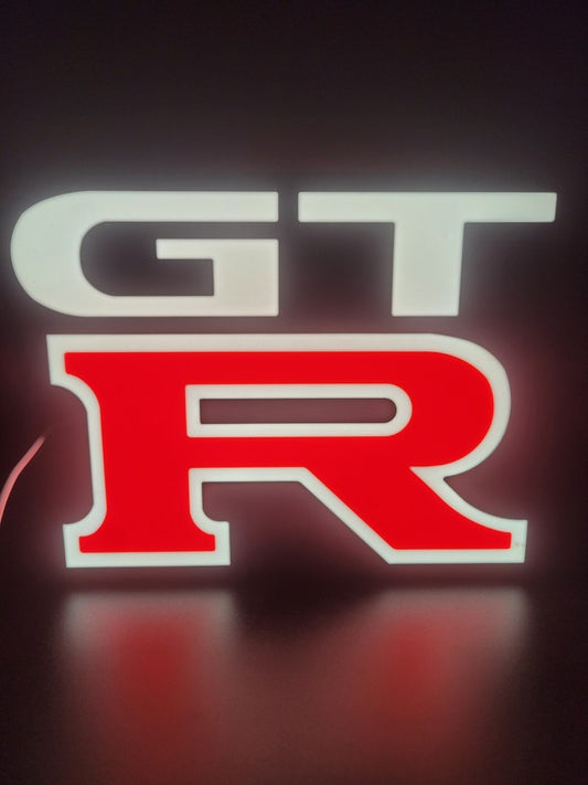 Nissan GTR LED light sign with illuminated logo viewed from straight on