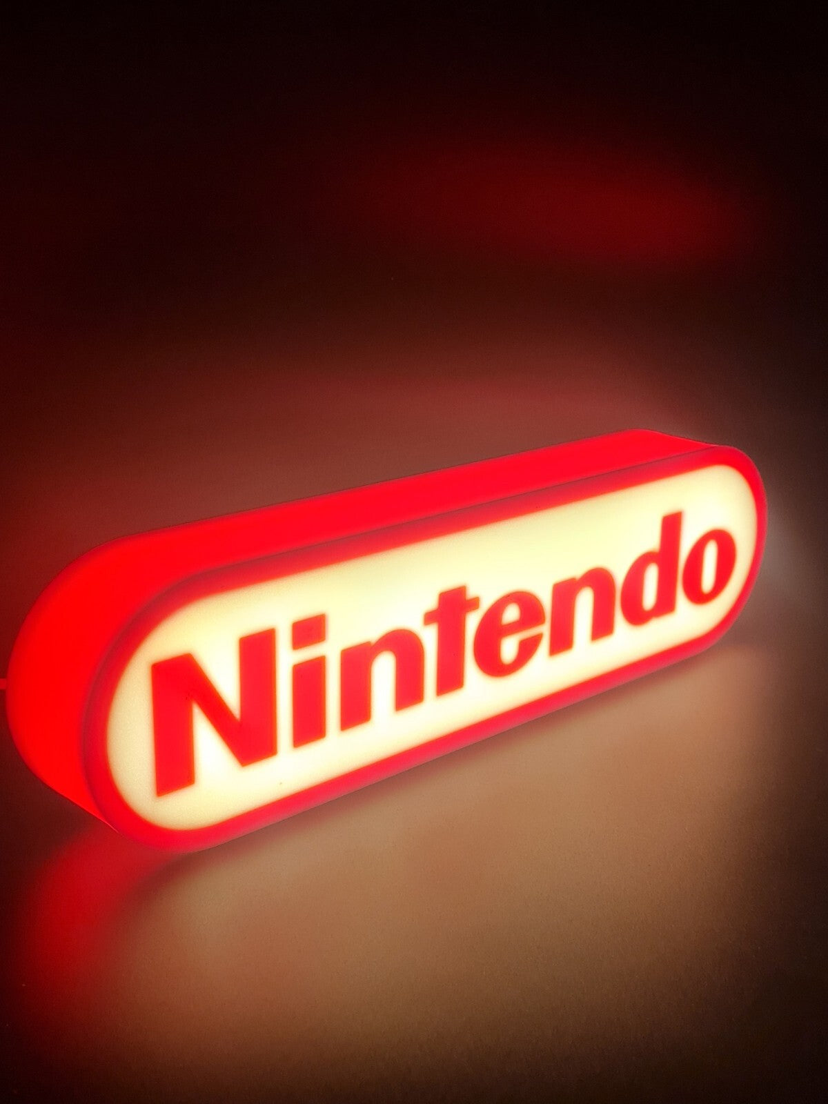 Nintendo LED light sign with illuminated logo viewed from side view