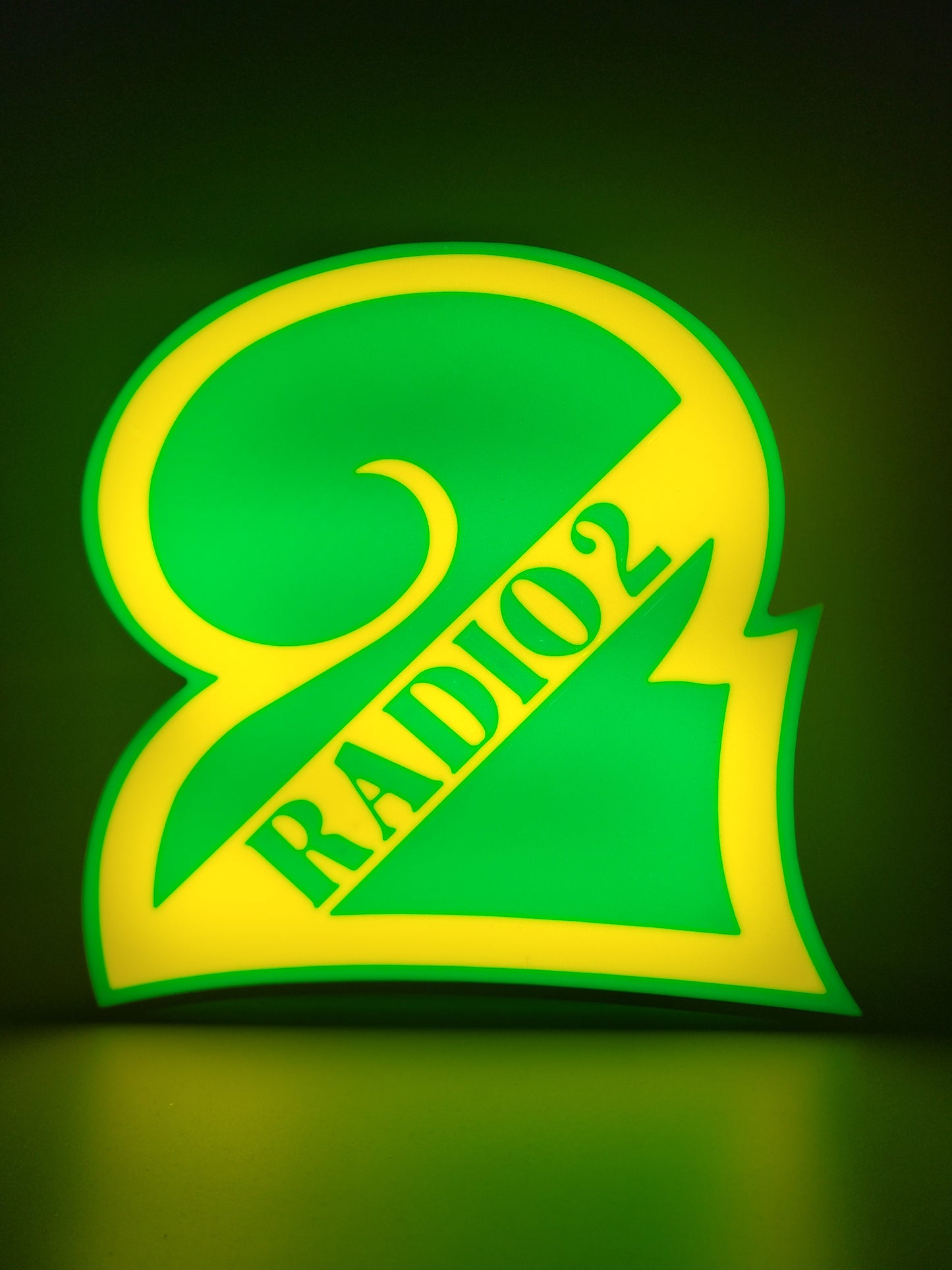 BBC radio 2 led light sign with illuminated logo viewed from straight on
