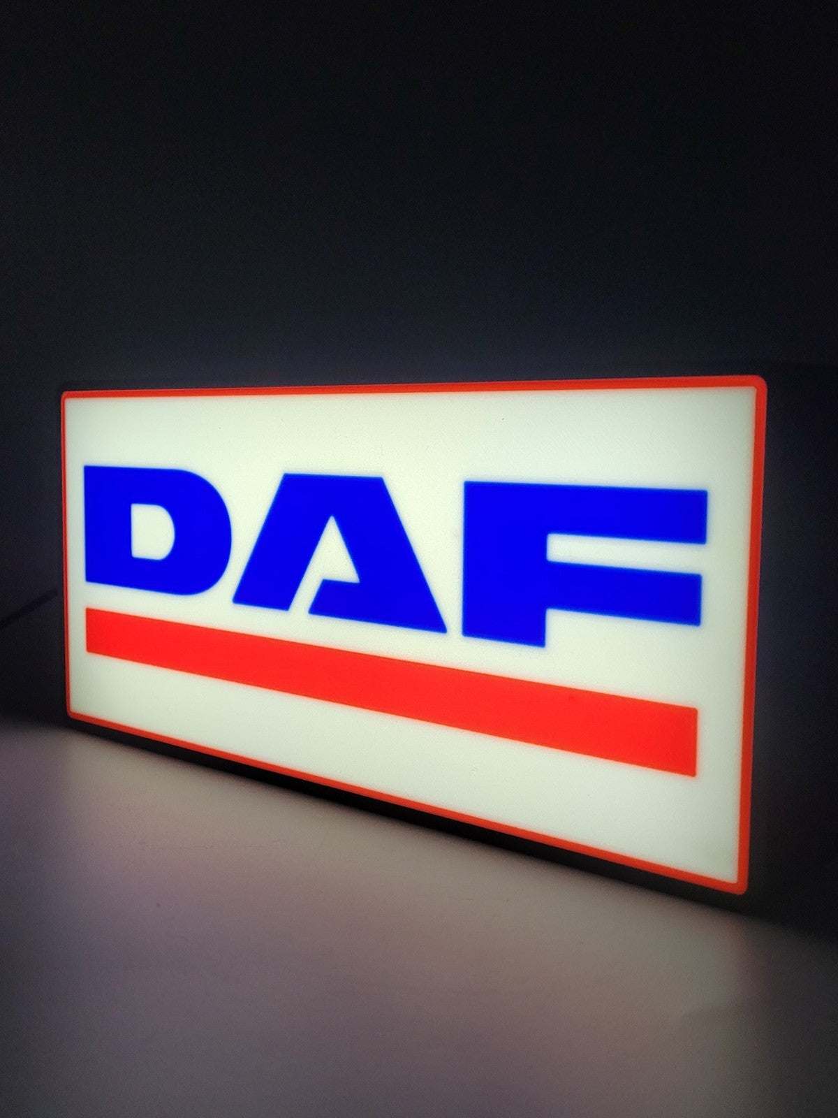 DAF led light sign with illuminated logo viewed from side view