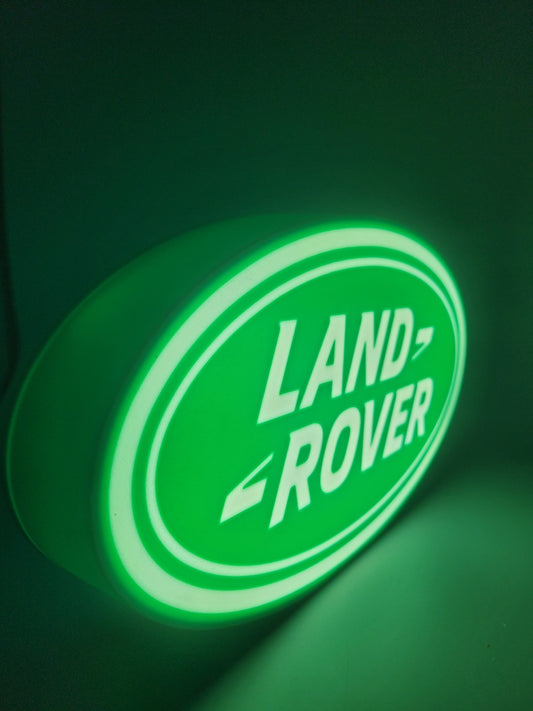 Land Rover LED light sign with illuminated logo viewed from side view