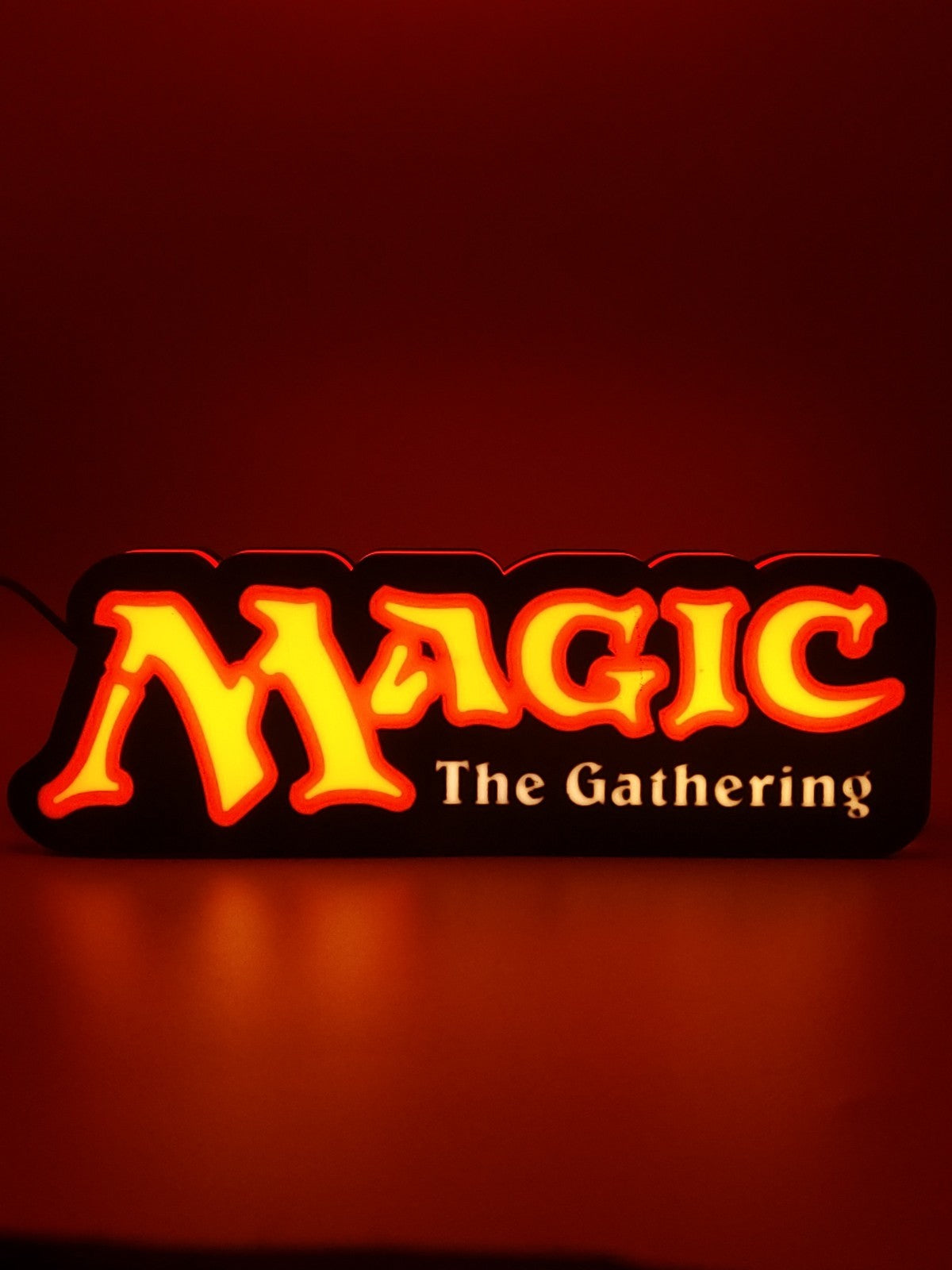 MAGIC THE GATHERING led light sign with illuminated logo viewed from straight on