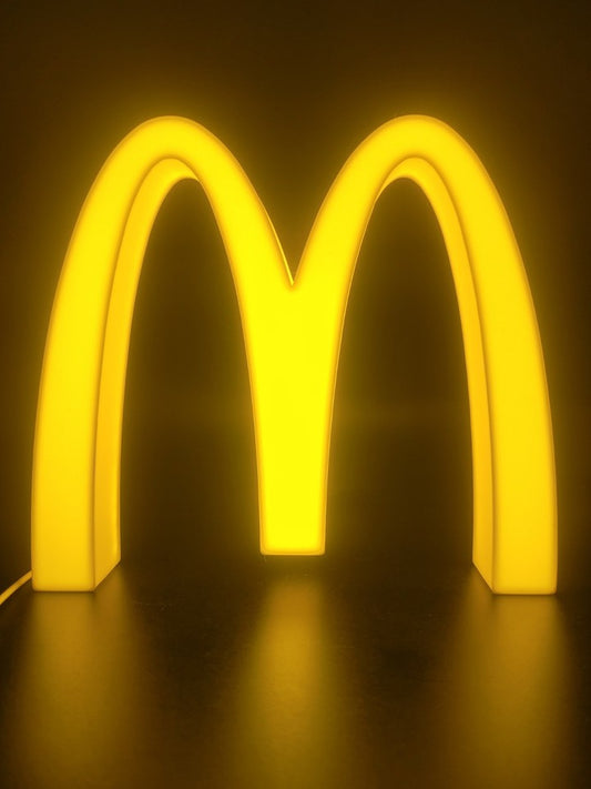 Mcdonalds LED light sign with illuminated logo viewed from straight on