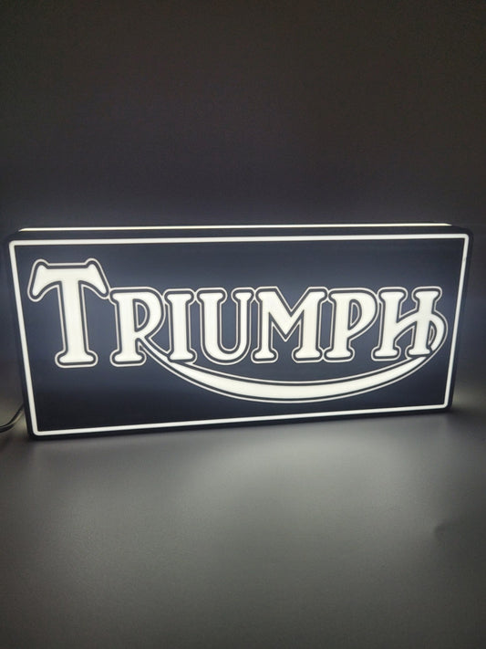 Triumph square LED light sign with illuminated logo viewed from straight on