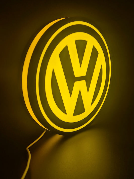 Volkswagen LED light sign with illuminated logo viewed from side view
