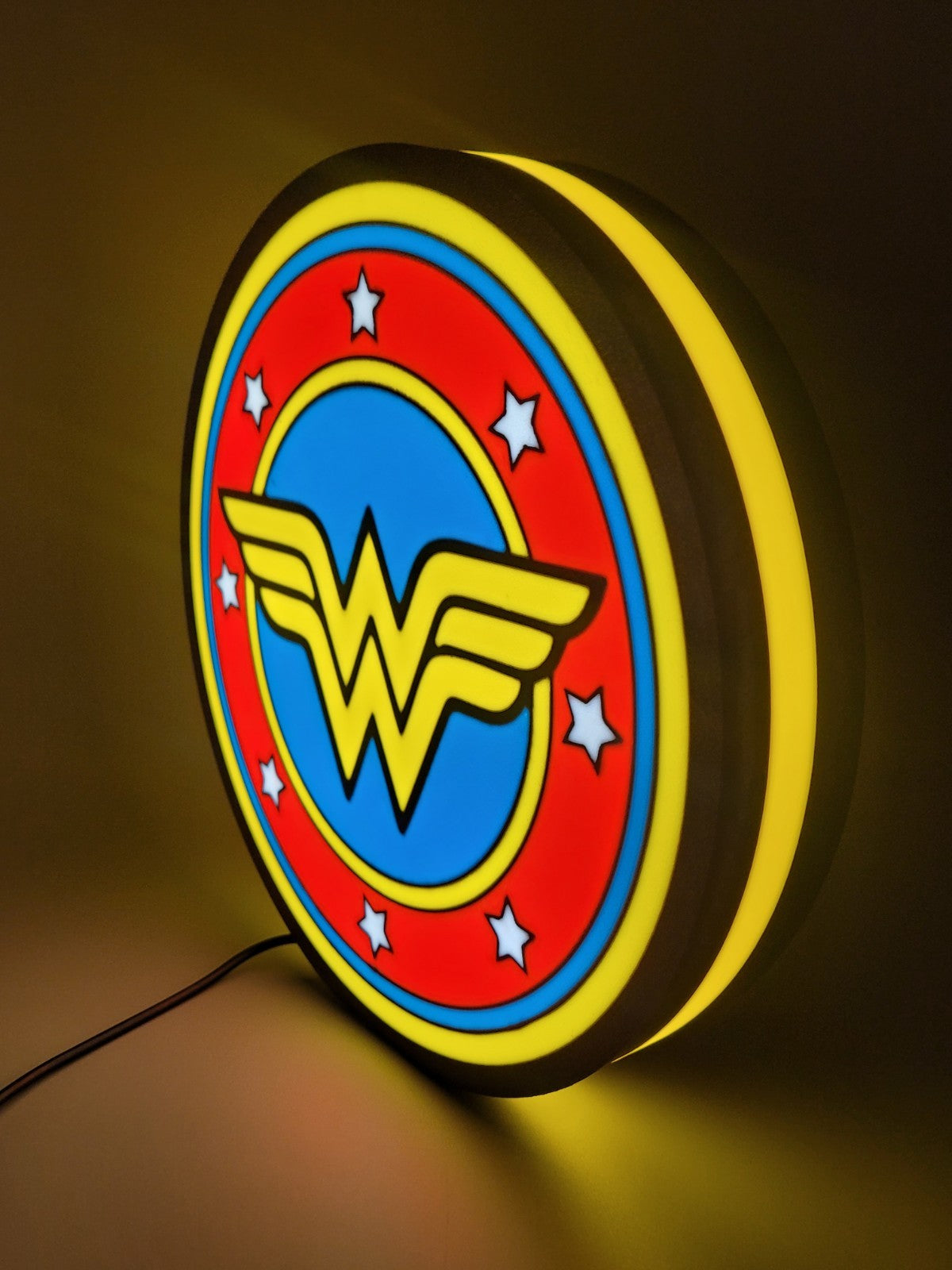 WONDER WOMAN led light sign with illuminated logo viewed from side view