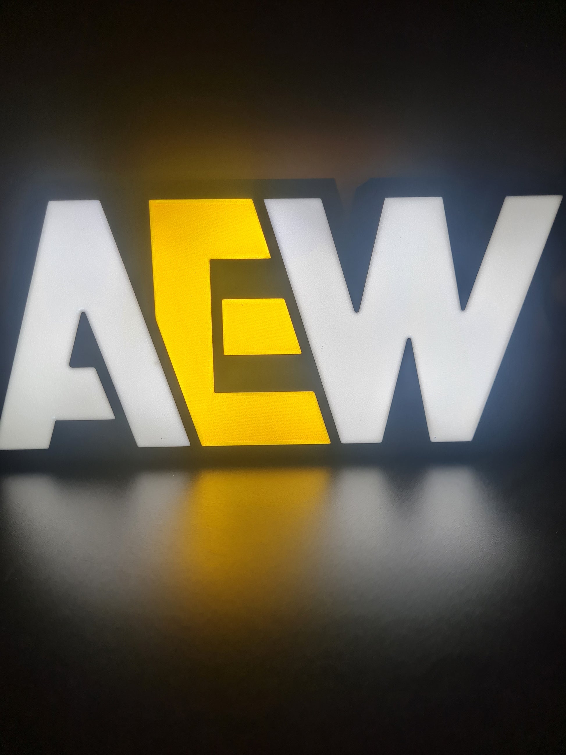 AEW LED light sign with illuminated logo viewed from straight on