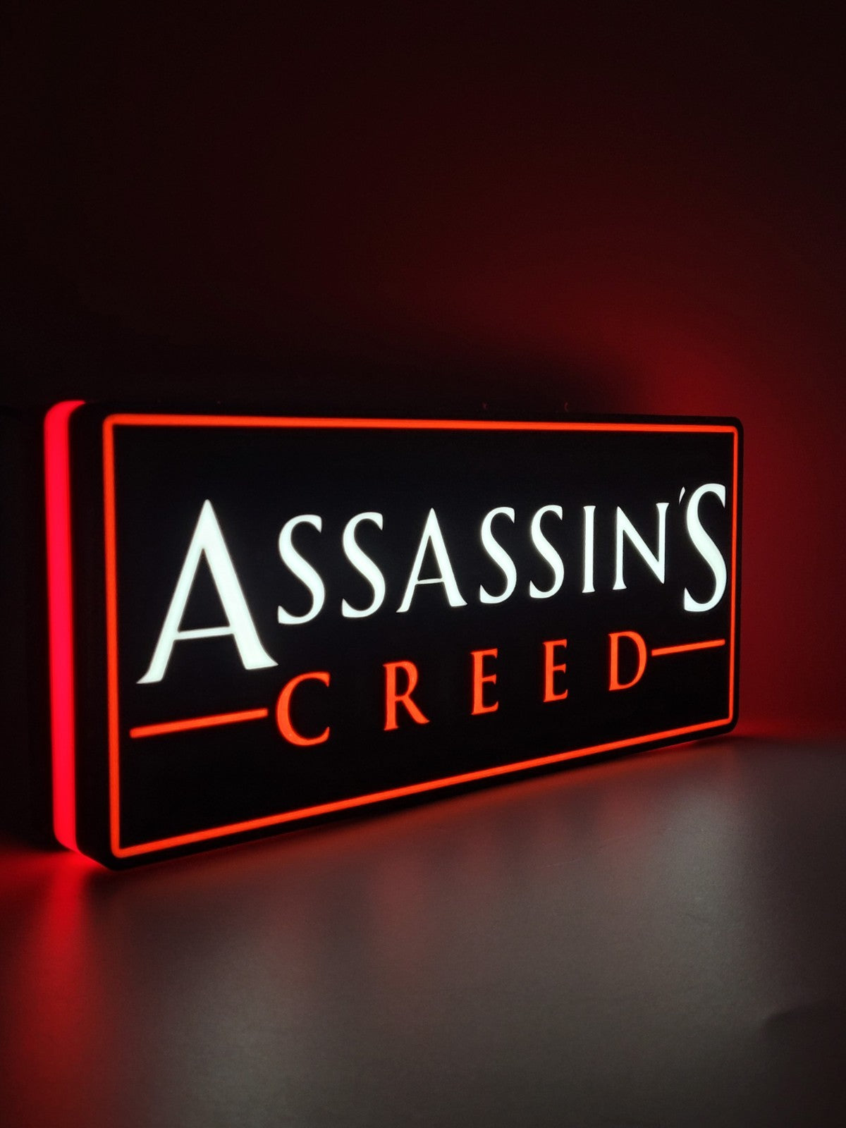 assassin's creed led light sign with illuminated logo viewed from side view