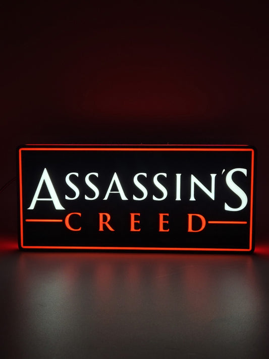 Assassin's Creed LED light sign with illuminated logo viewed from straight on