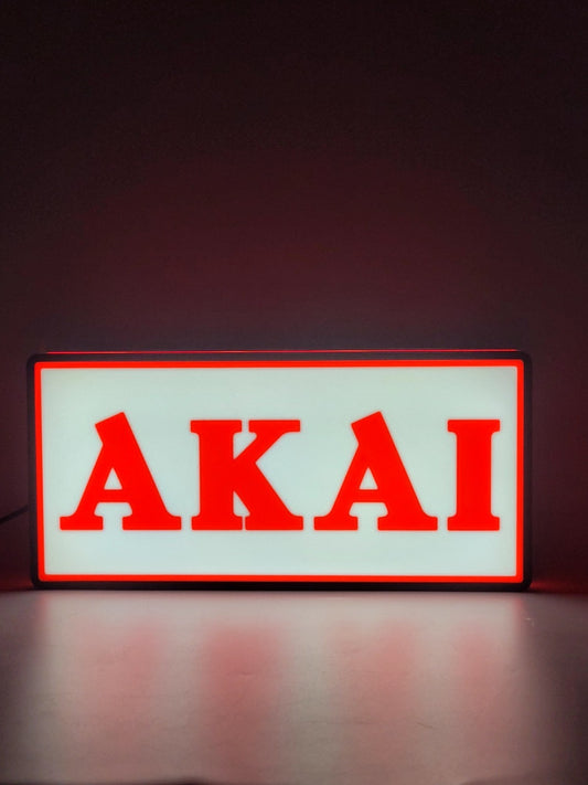 Akai led light sign with illuminated logo viewed from straight on
