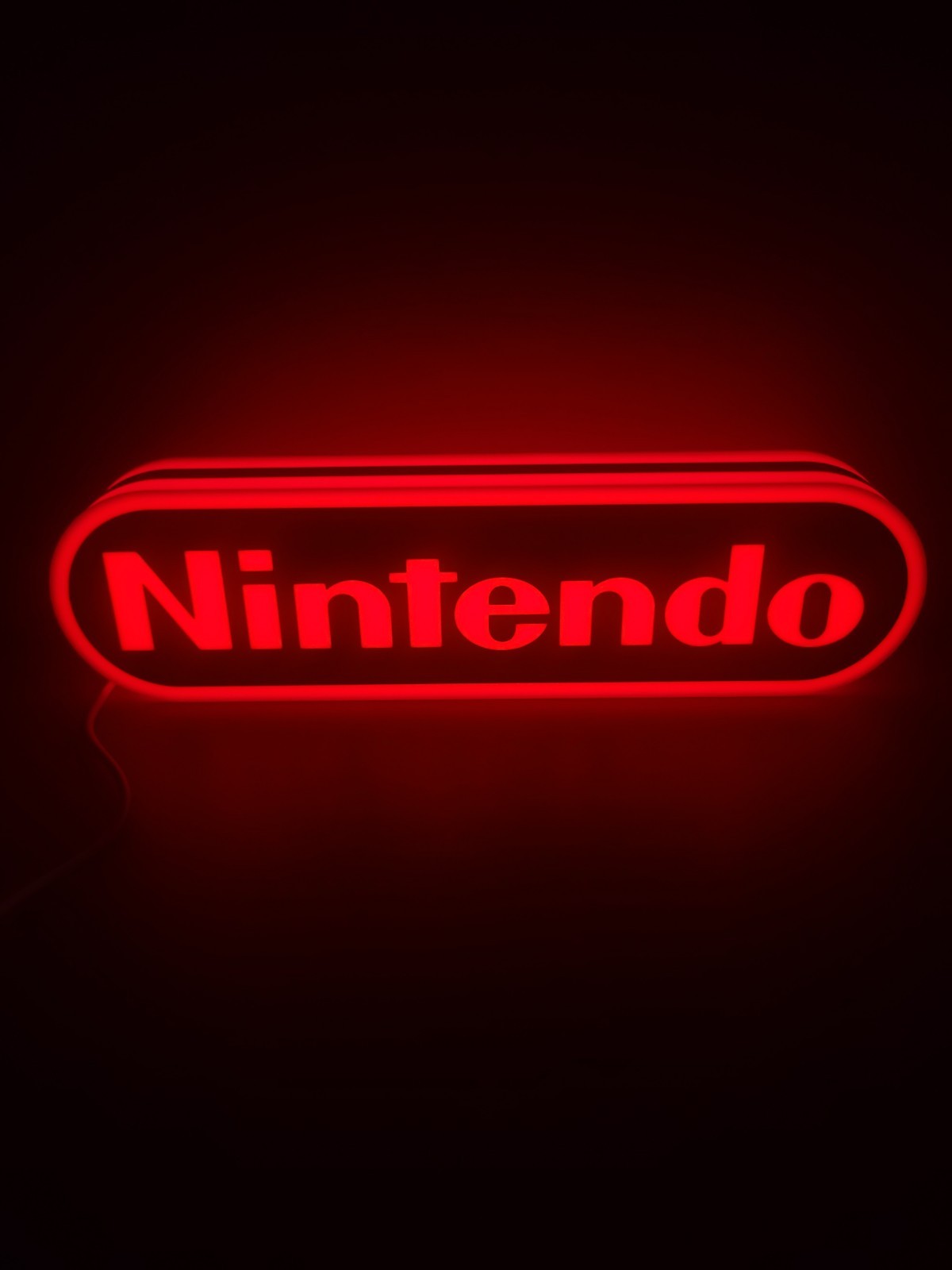 Nintendo LED light sign with illuminated logo viewed from straight on