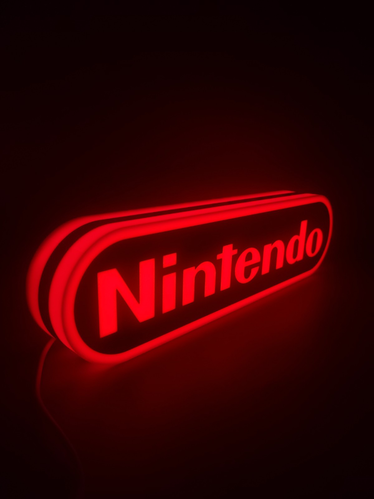 nintendo LED light sign with illuminated logo viewed from side view