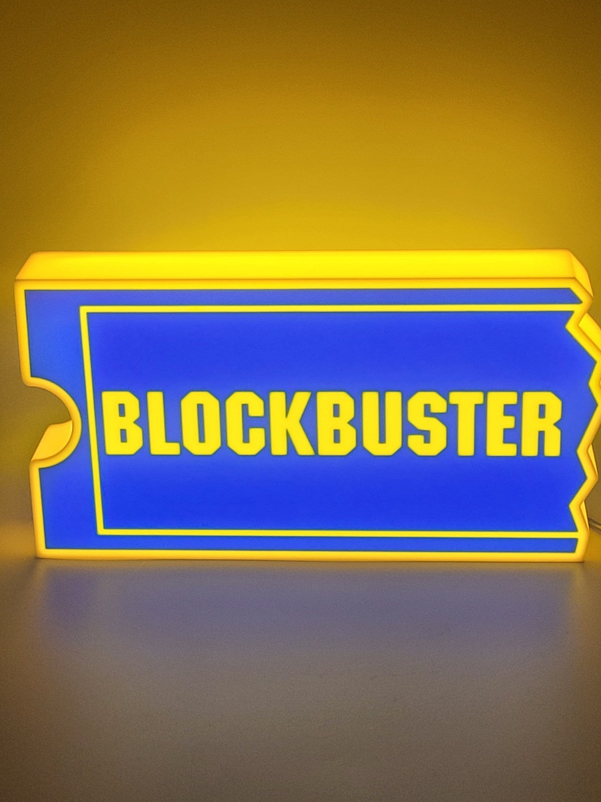 Blockbuster LED light sign with illuminated logo viewed from straight on