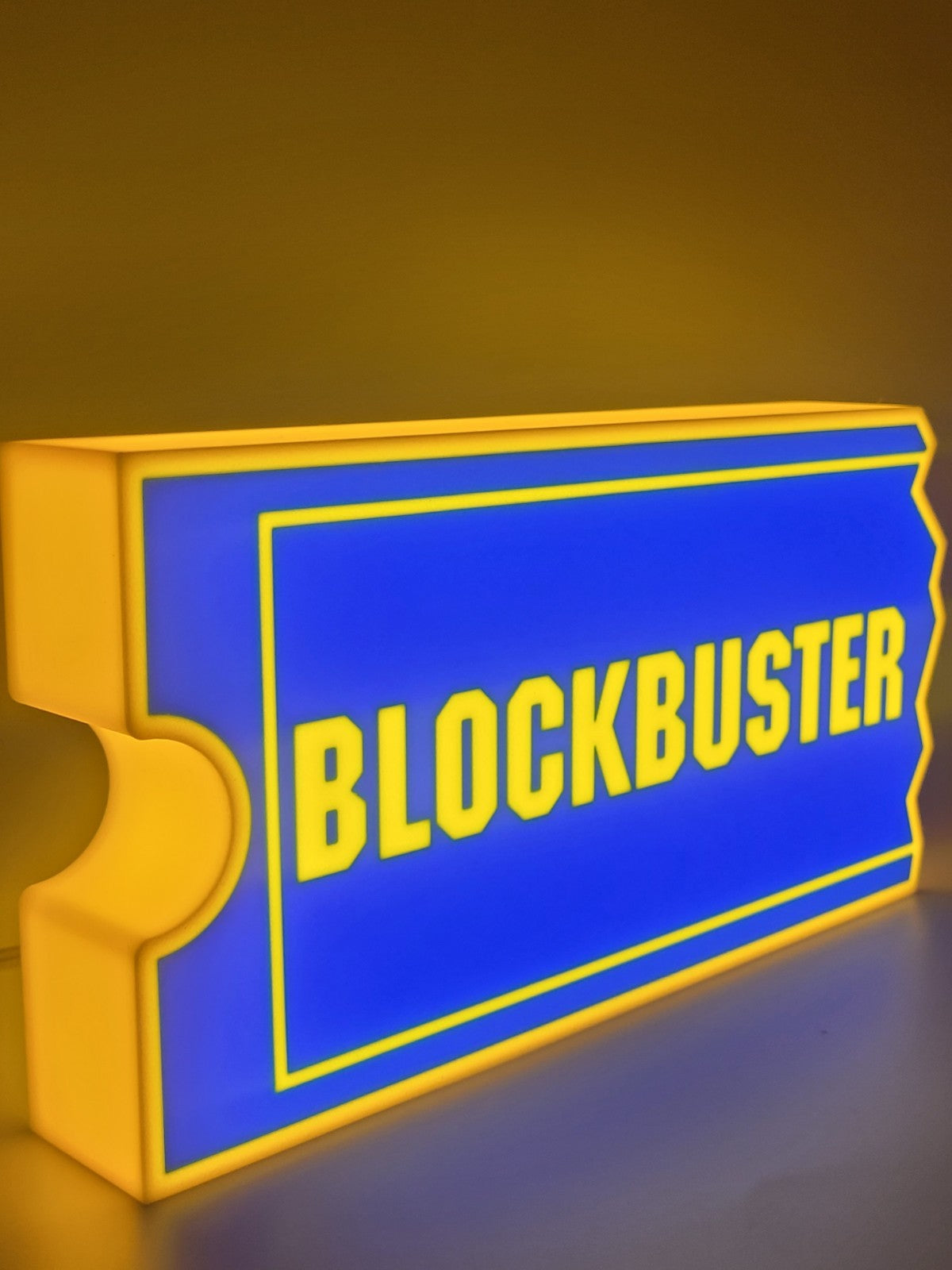 Blockbuster LED light sign with illuminated logo viewed from side view
