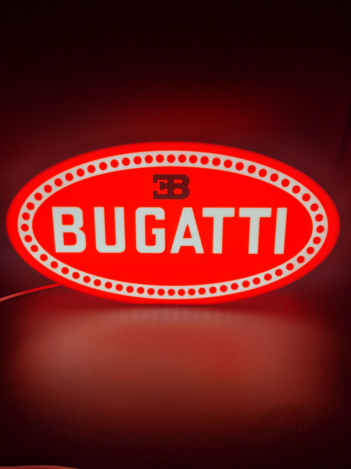 Bugatti LED light sign with illuminated logo viewed from straight on