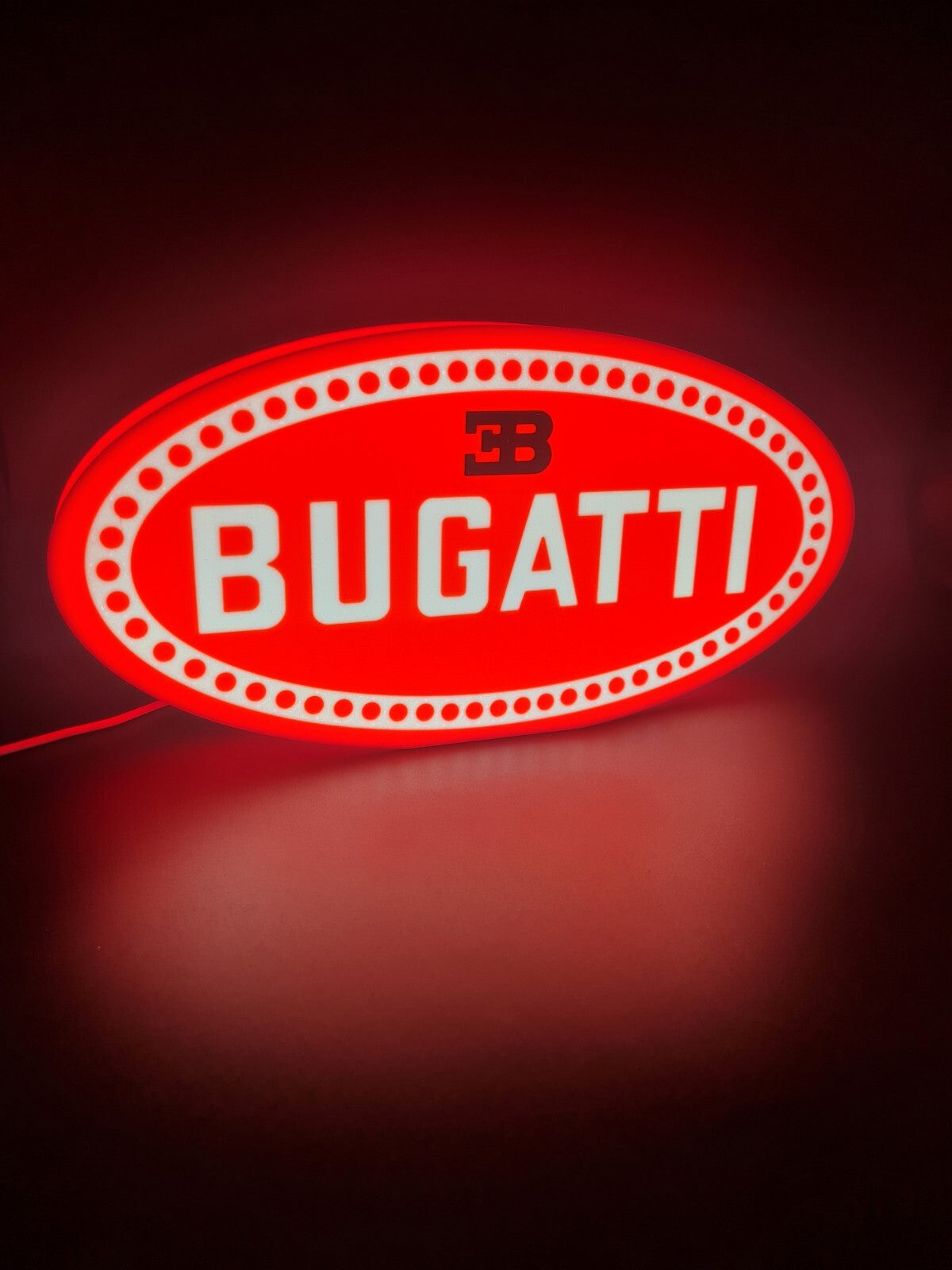 bugatti led light sign with illuminated logo viewed from side view