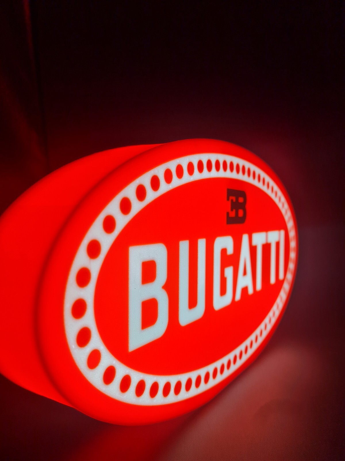 bugatti led light sign with illuminated logo viewed from side view