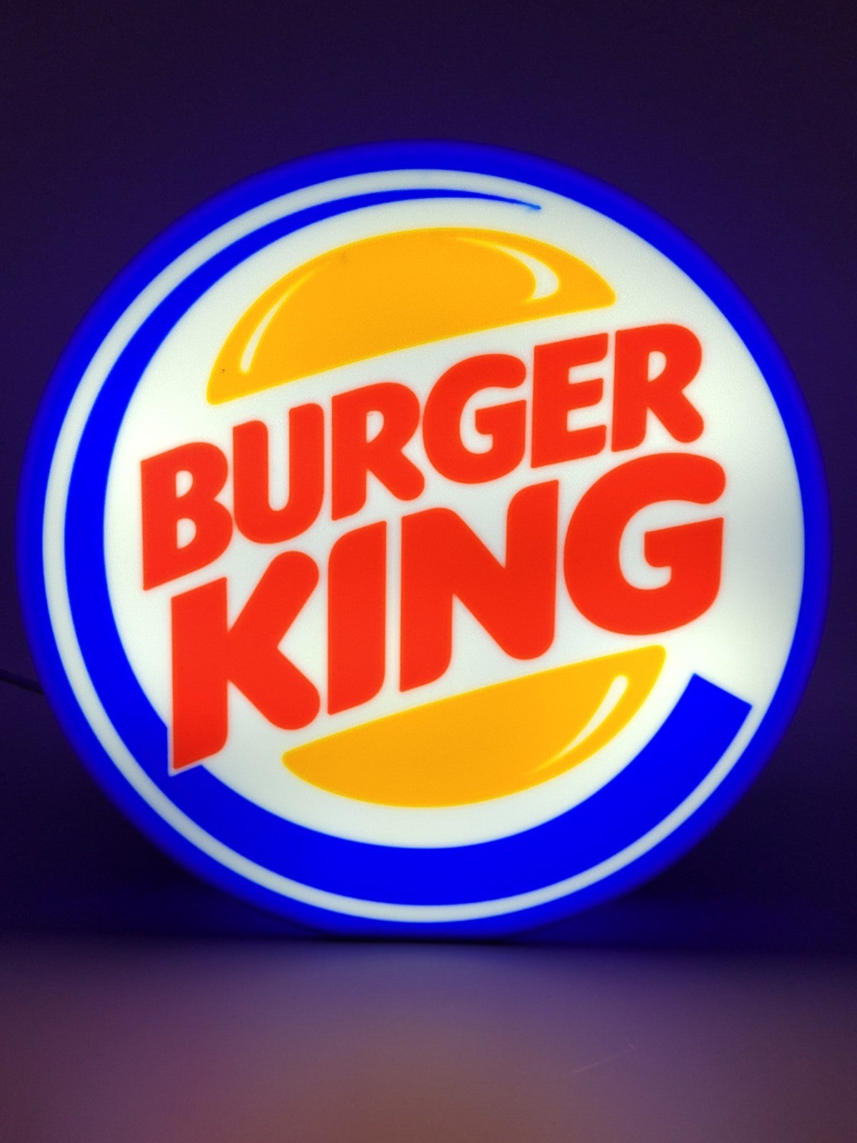 Burger King LED light sign with illuminated logo viewed from straight on