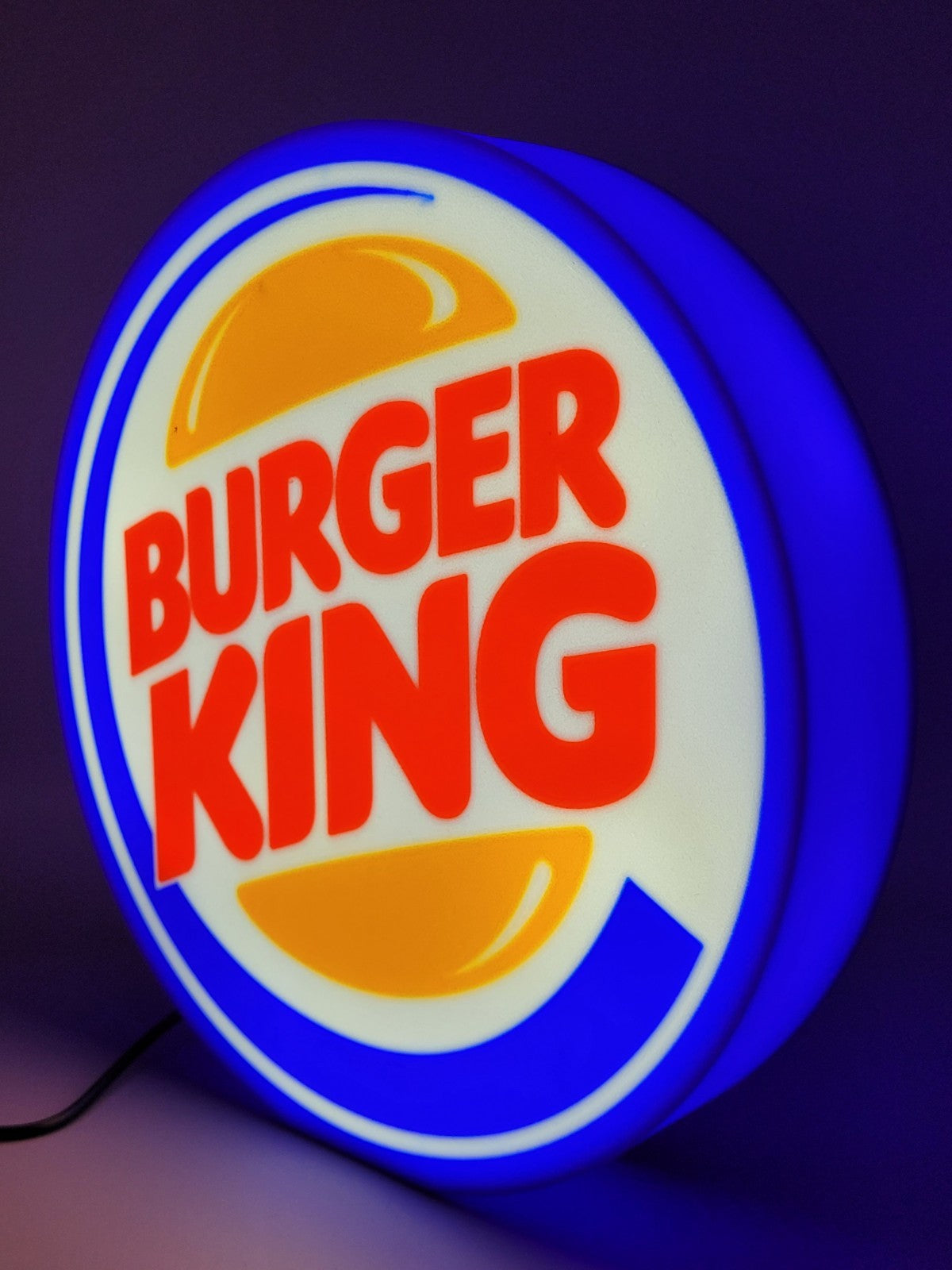 Burger King LED light sign with illuminated logo viewed from side view