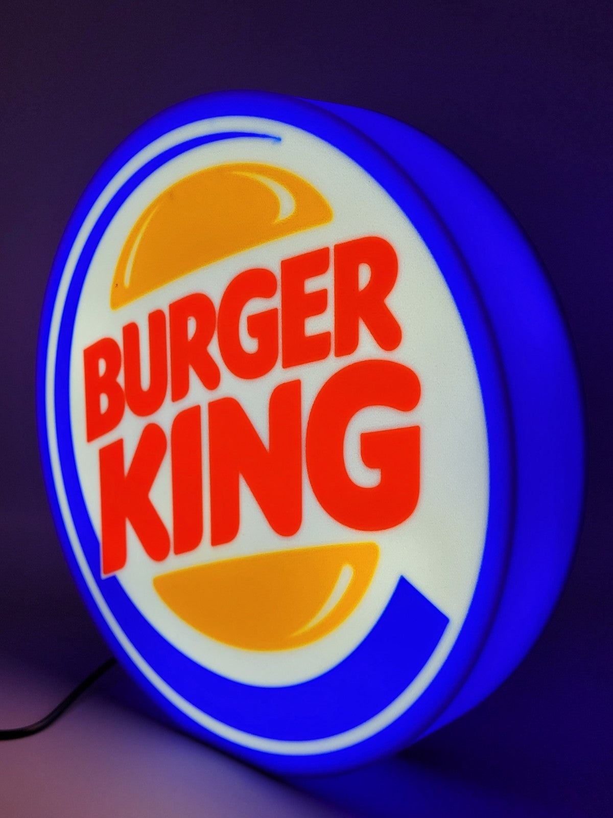 Burger King LED light sign with illuminated logo viewed from side view