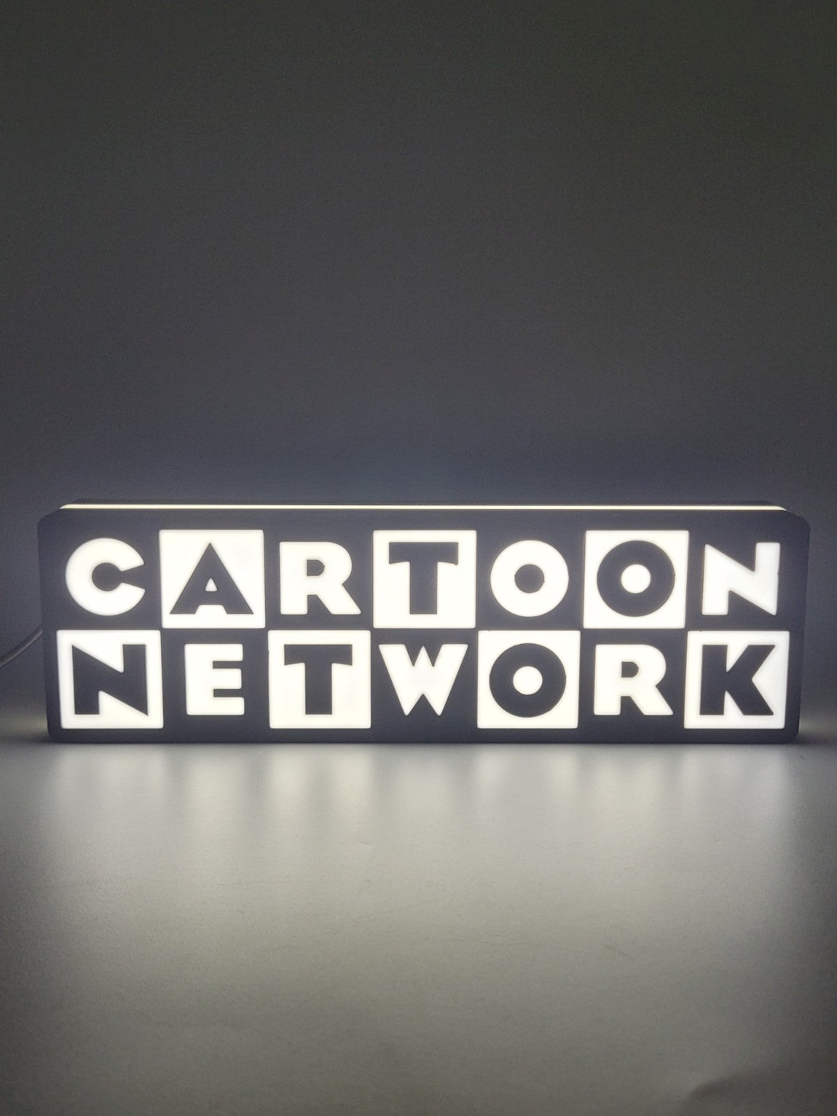 Cartoon Network LED light sign with illuminated logo viewed from straight on
