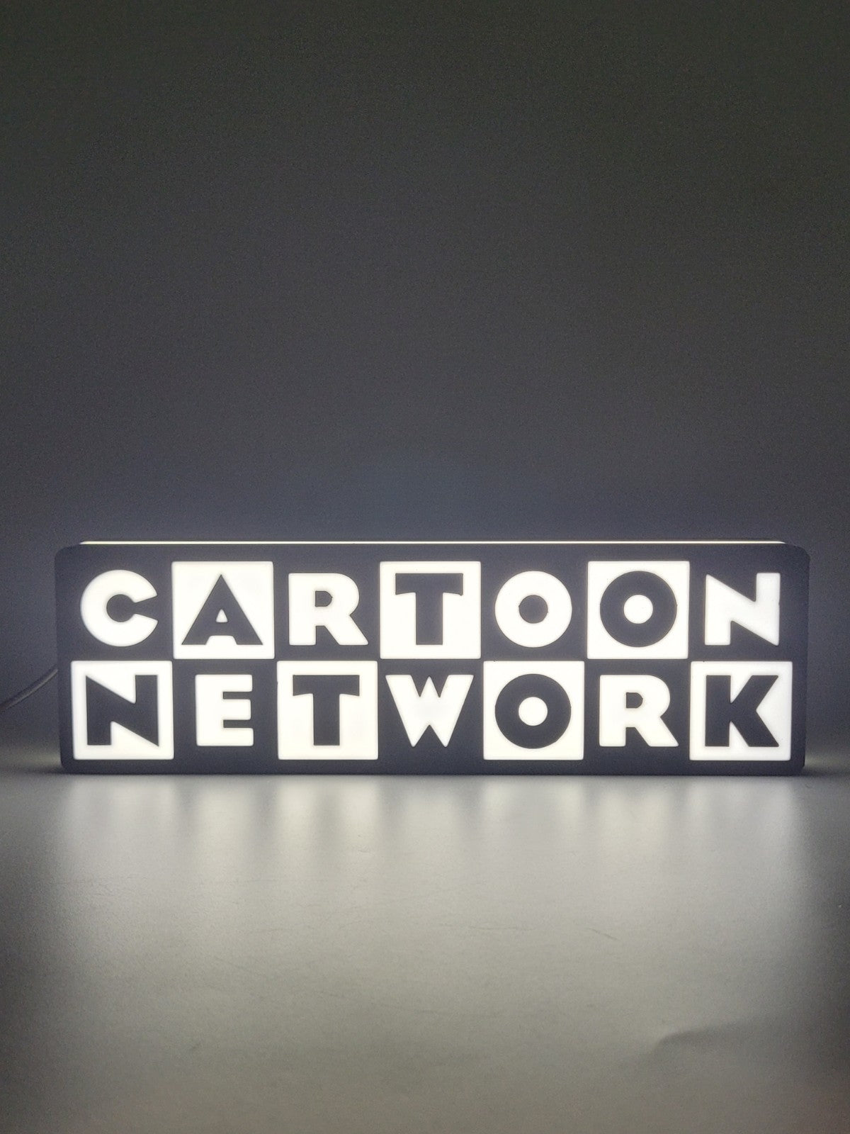 Cartoon Network LED light sign with illuminated logo viewed from straight on