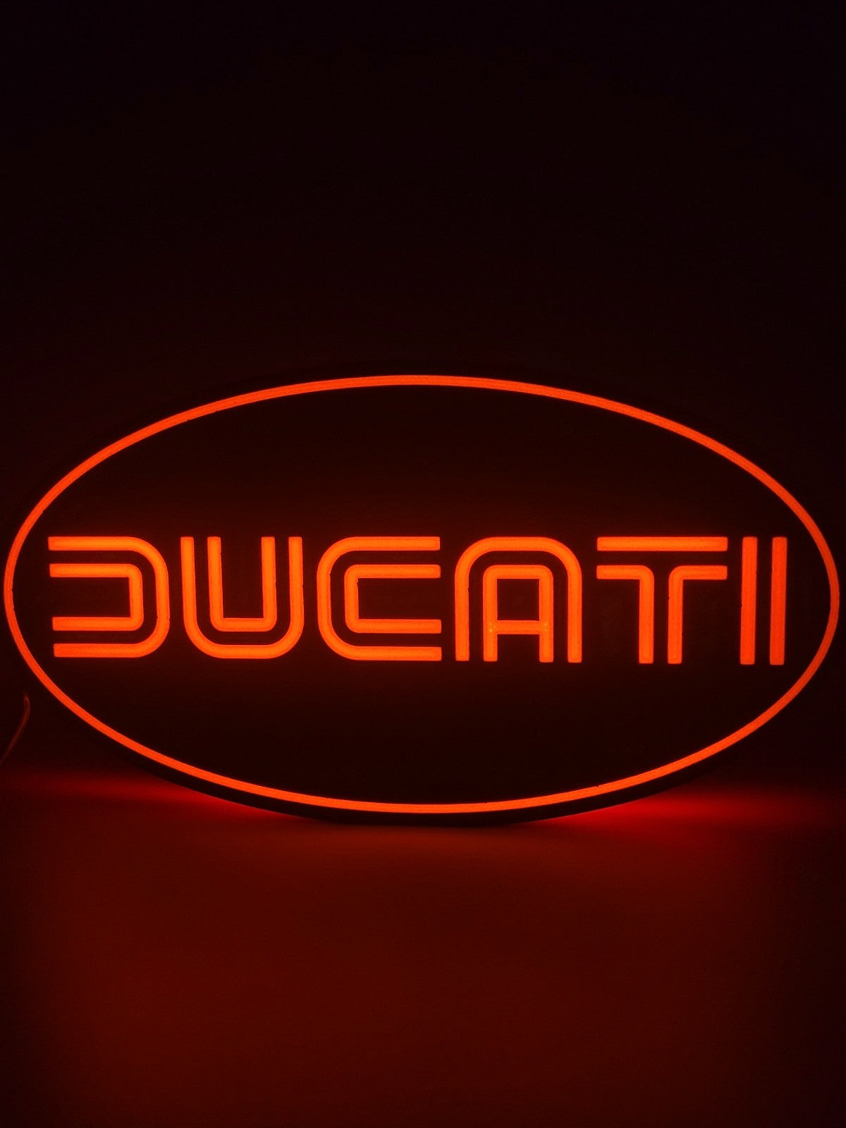 Ducati LED light sign with illuminated logo viewed from straight on
