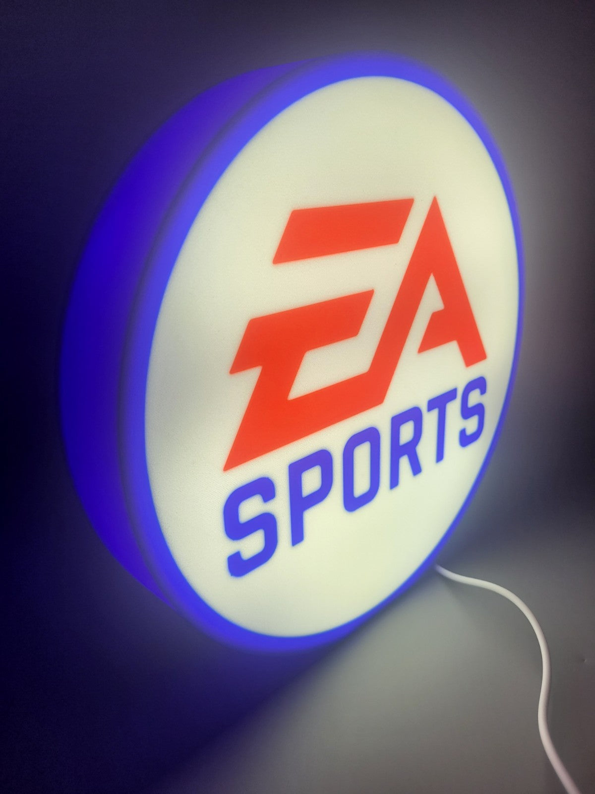 ea sports LED light sign with illuminated logo viewed from side view