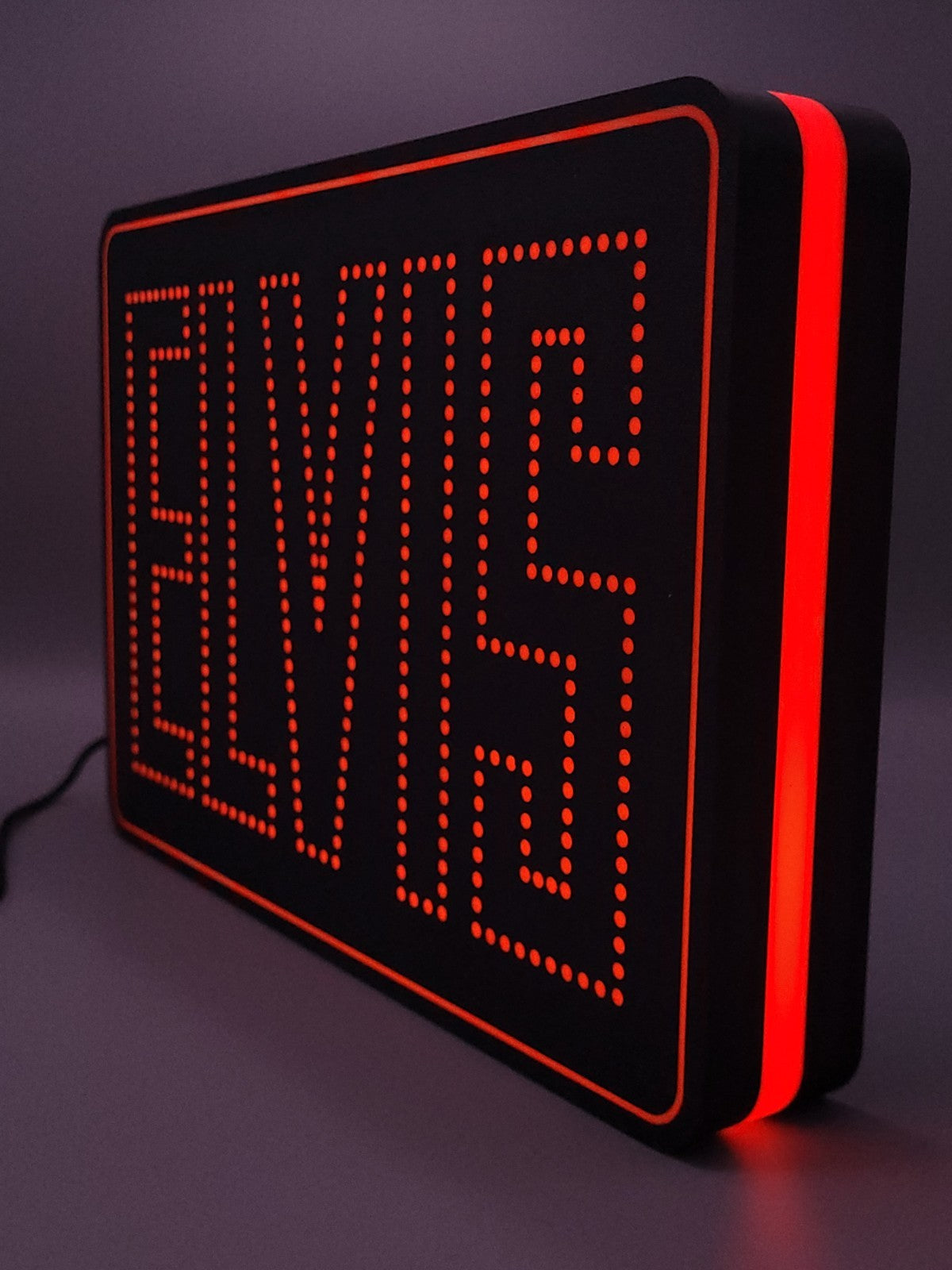 elvis led light sign with illuminated logo viewed from side view