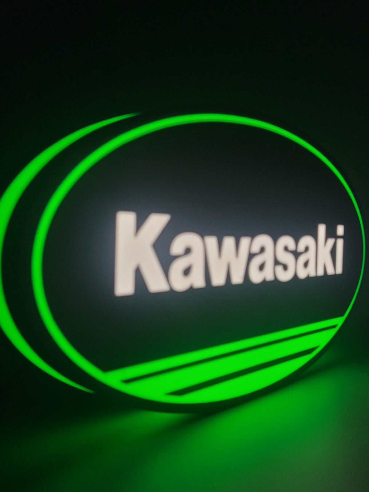 kawasaki LED light sign with illuminated logo viewed from side view
