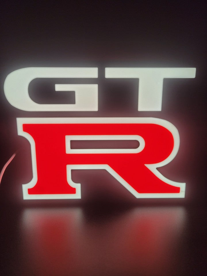 Nissan GTR LED light sign with illuminated logo viewed from straight on
