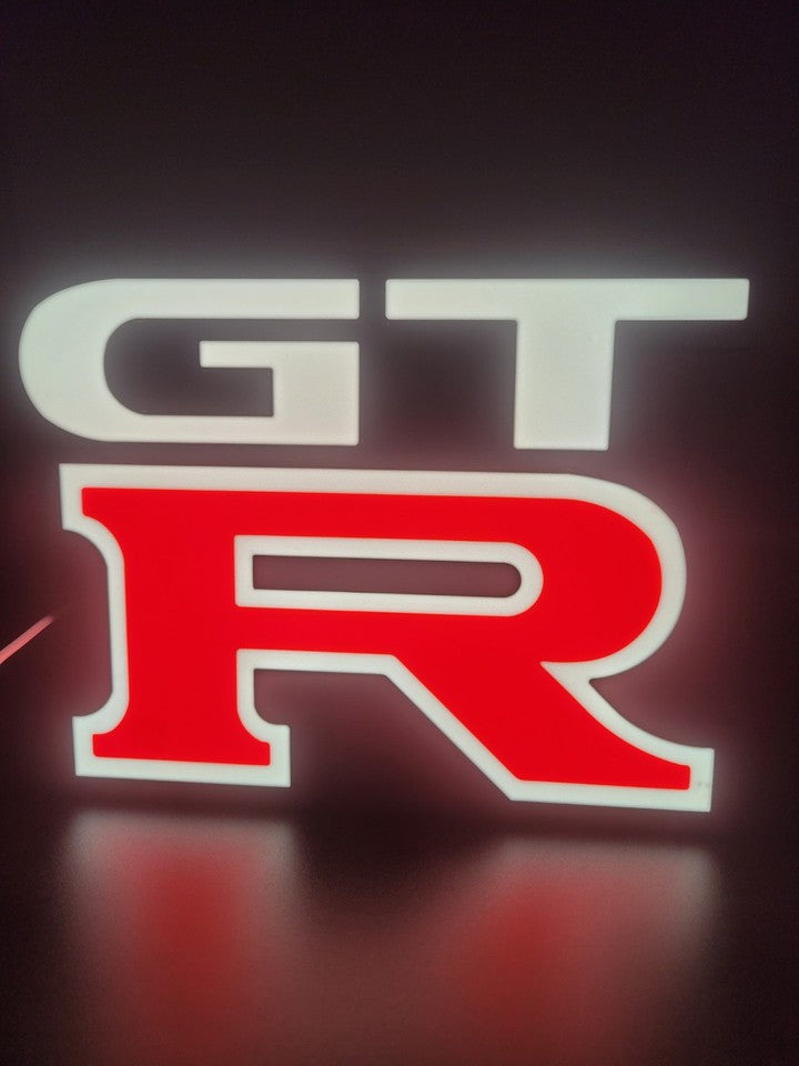 Nissan GTR LED light sign with illuminated logo viewed from straight on