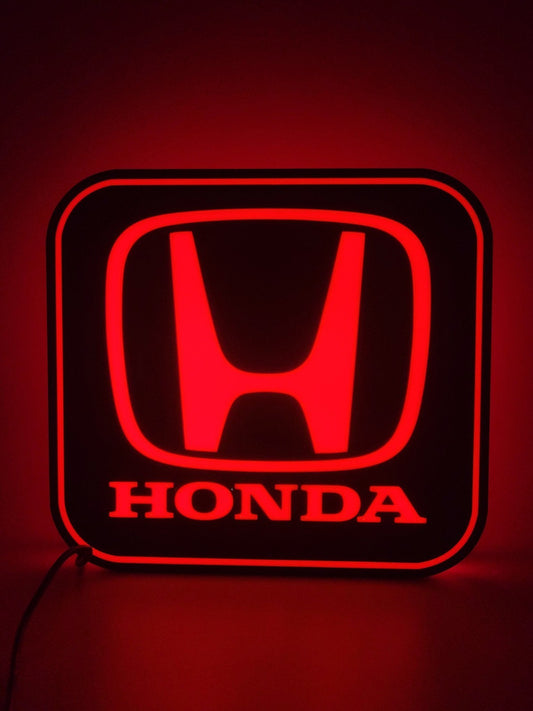 Honda LED light sign with illuminated logo viewed from straight on