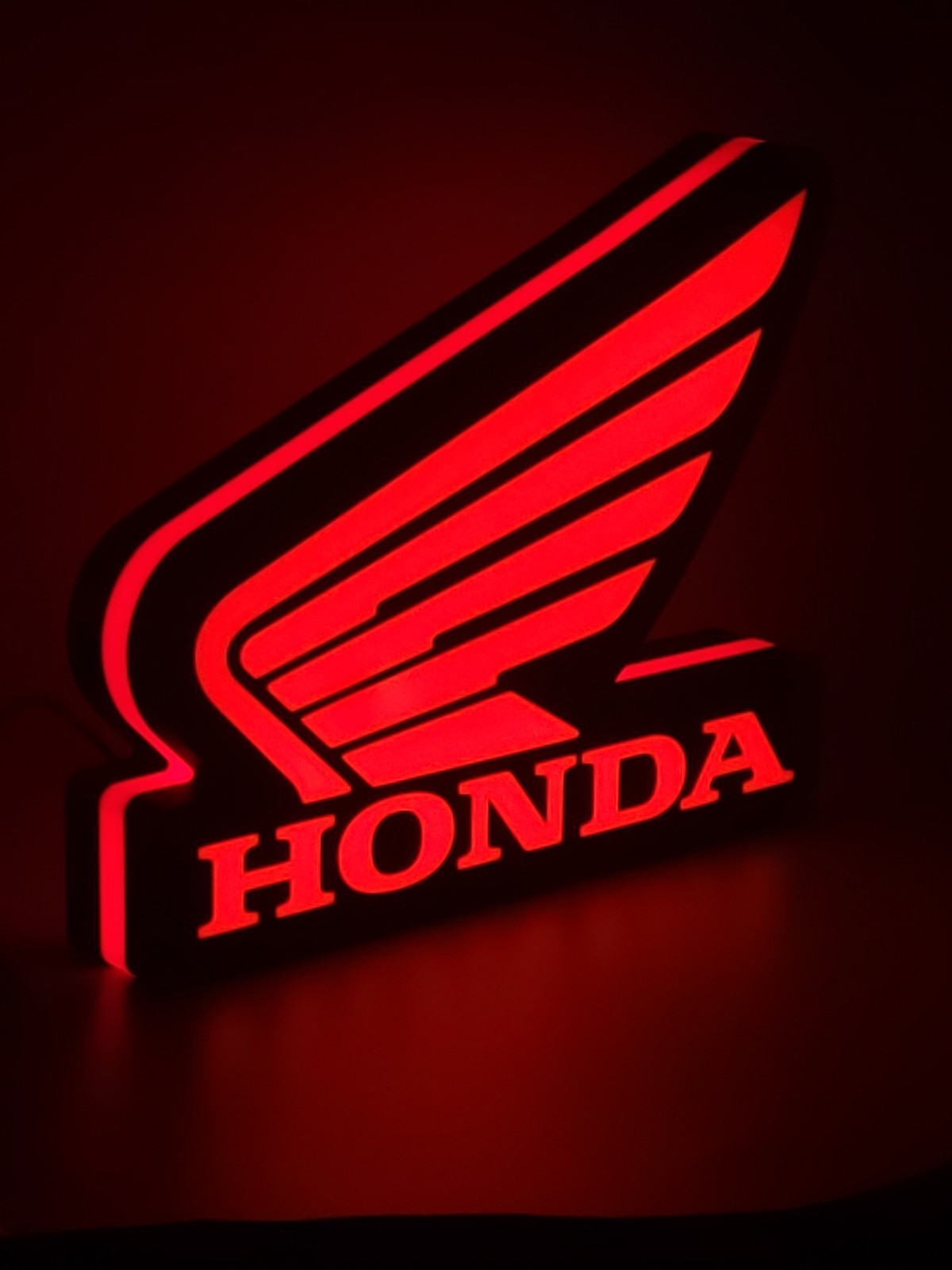 honda wing LED light sign with illuminated logo viewed from side view