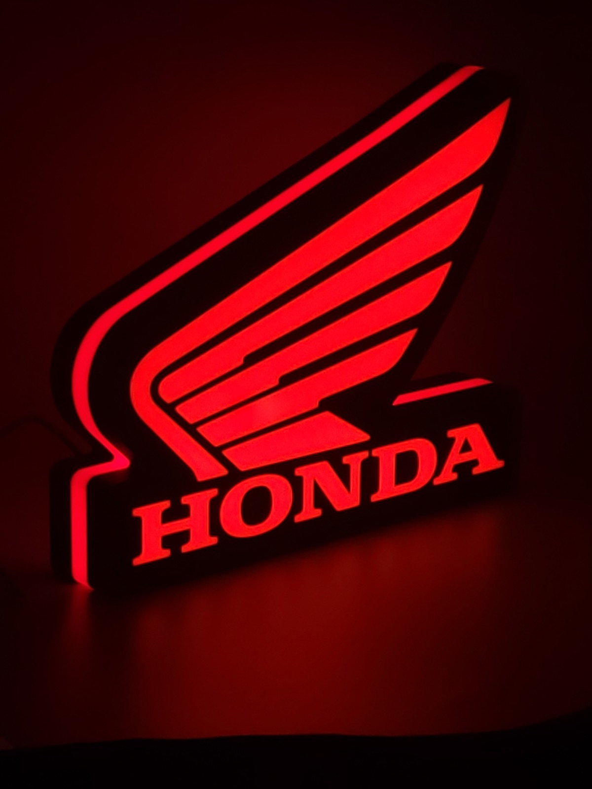 honda wing LED light sign with illuminated logo viewed from side view