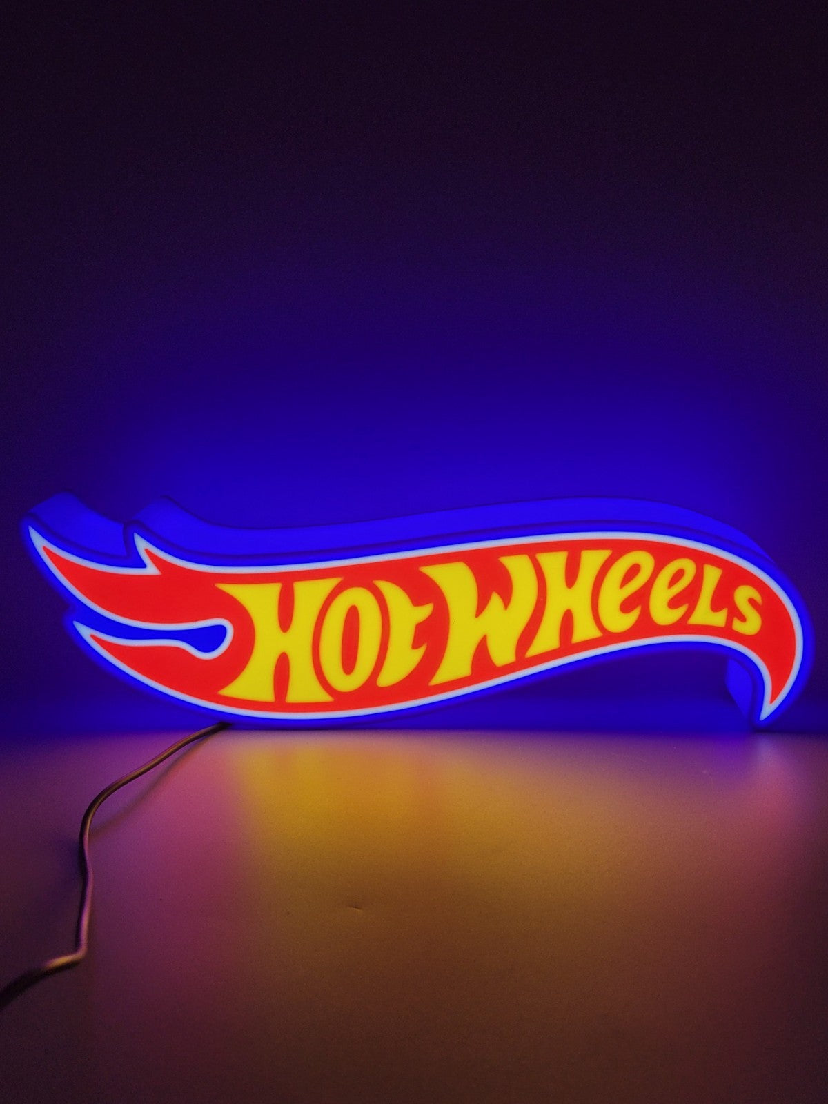 Hotwheels LED light sign with illuminated logo viewed from straight on