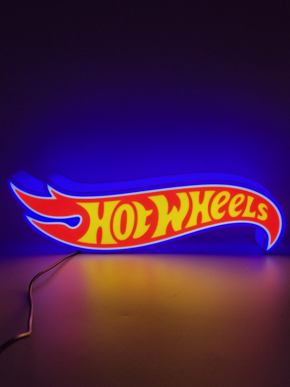 Hotwheels LED light sign with illuminated logo viewed from straight on