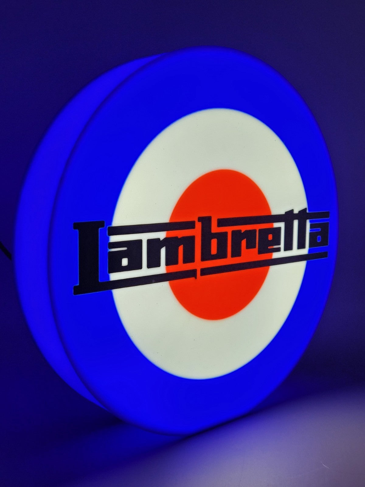 Lambretta LED light sign with illuminated logo viewed from side view