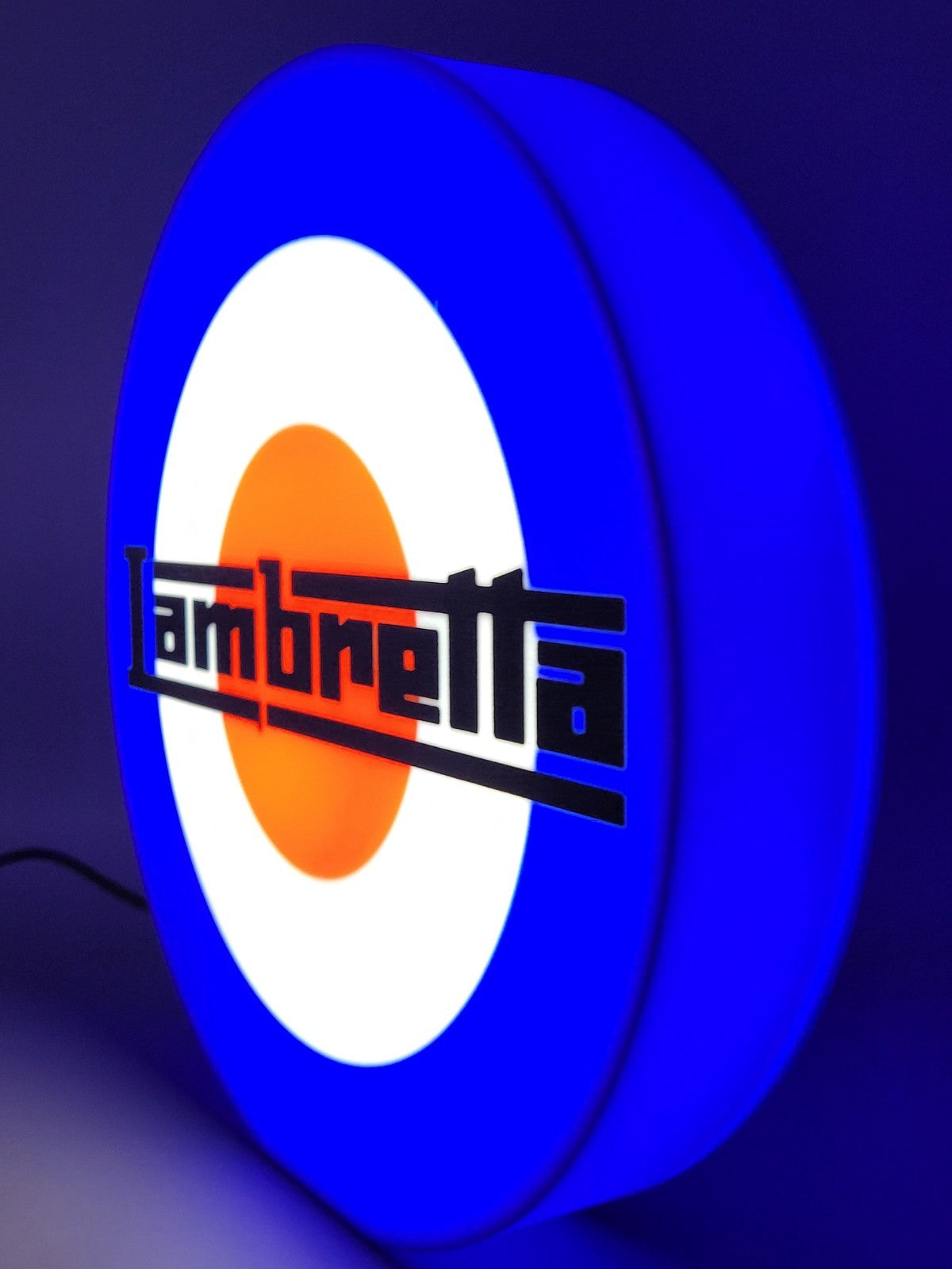 Lambretta LED light sign with illuminated logo viewed from side view