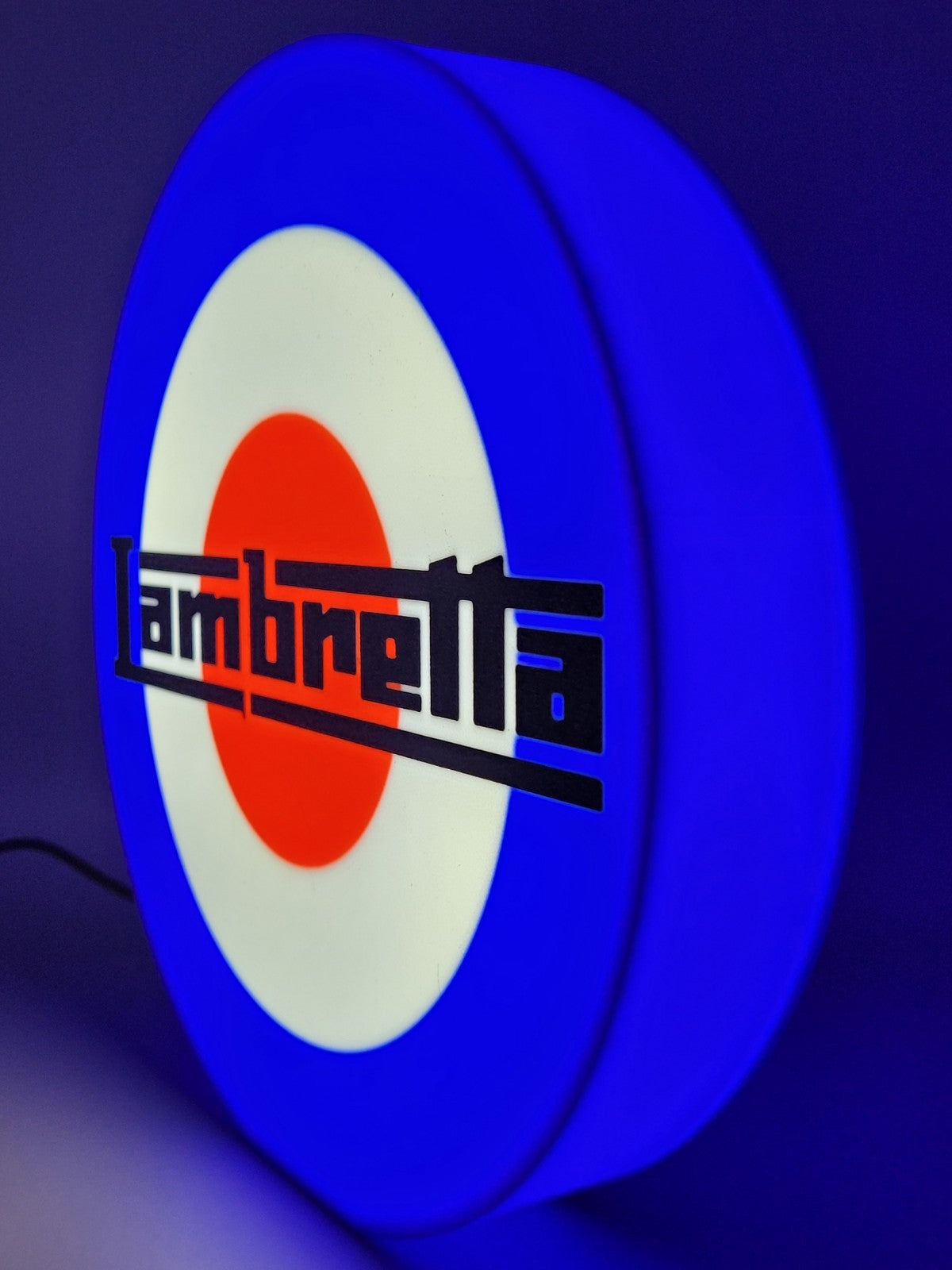 Lambretta LED light sign with illuminated logo viewed from side view