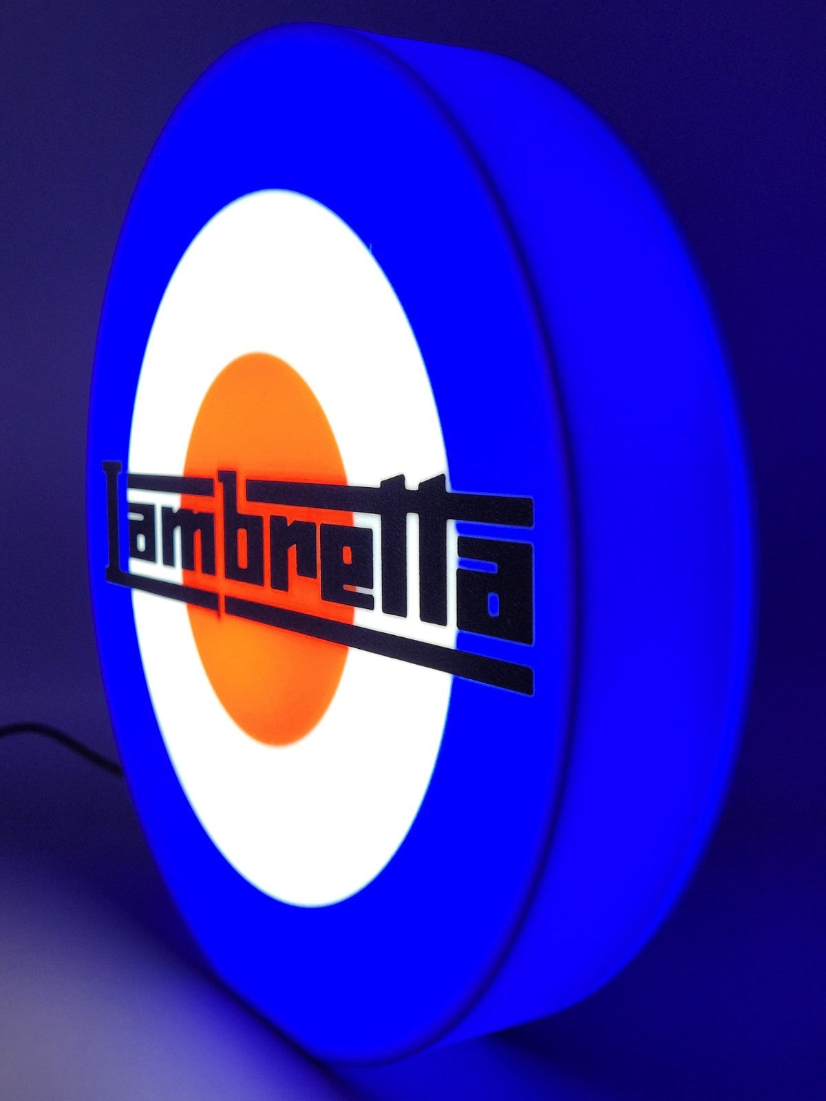 Lambretta LED light sign with illuminated logo viewed from side view