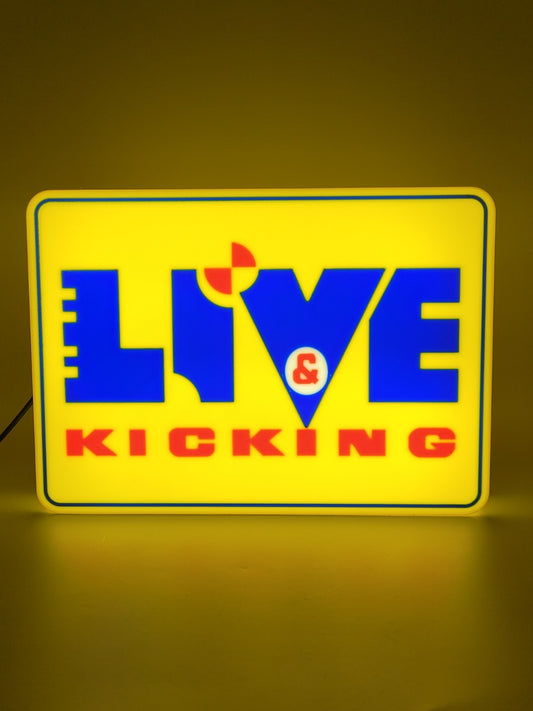 Live And Kicking LED light sign with illuminated logo viewed from straight on