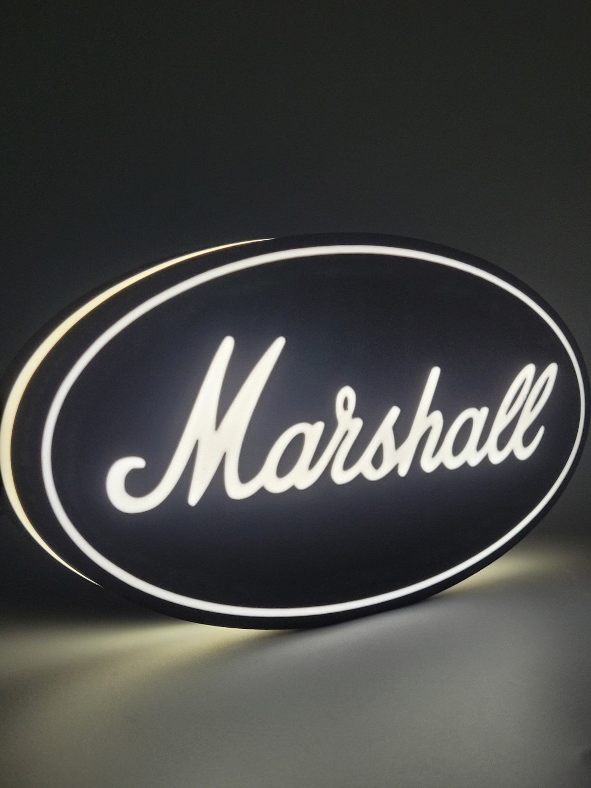 marshall LED light sign with illuminated logo viewed from side view