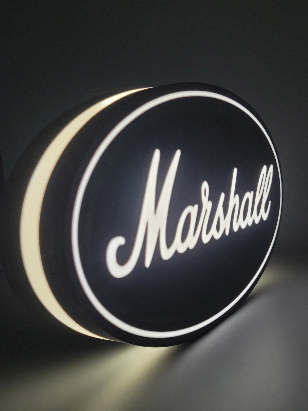 marshall LED light sign with illuminated logo viewed from side view