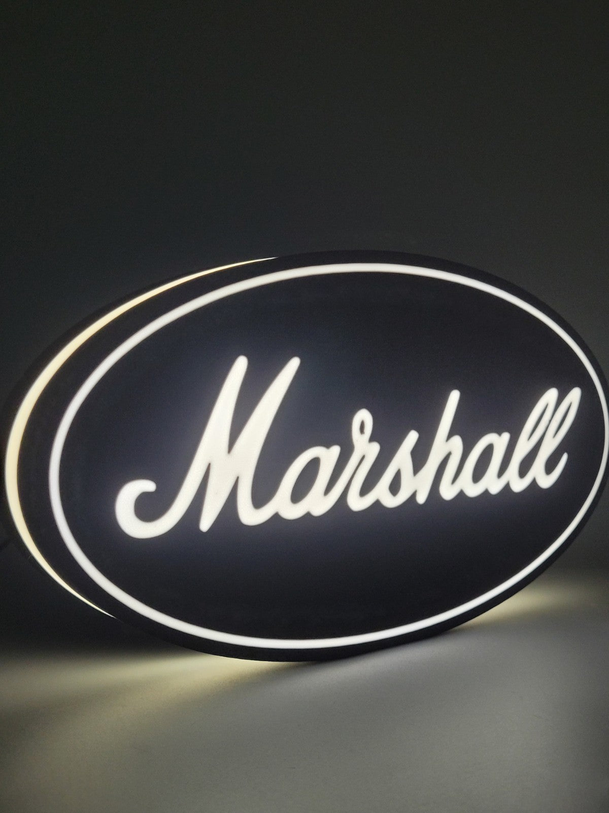 marshall LED light sign with illuminated logo viewed from side view