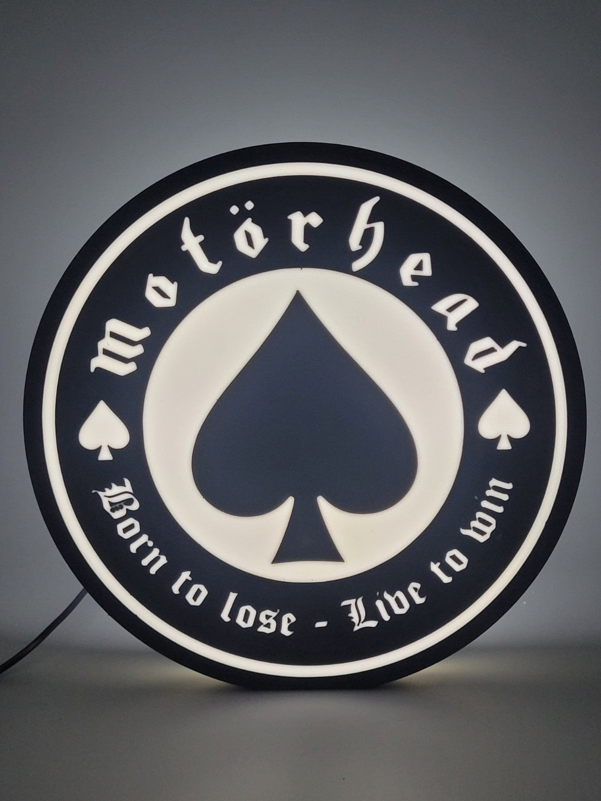 Motorhead LED light sign with illuminated logo viewed from straight on
