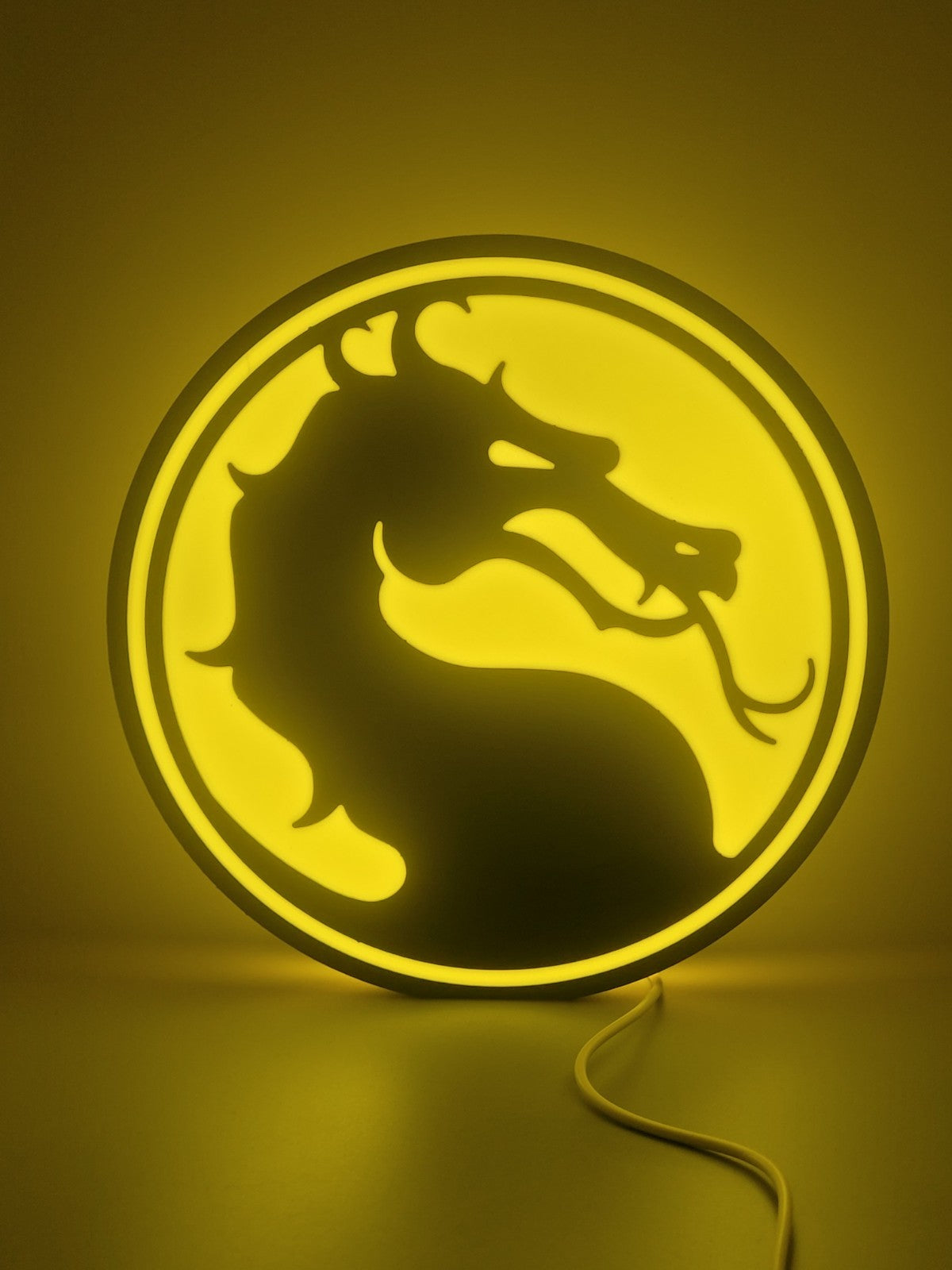 Mortal Kombat led light sign with illuminated logo viewed from straight on