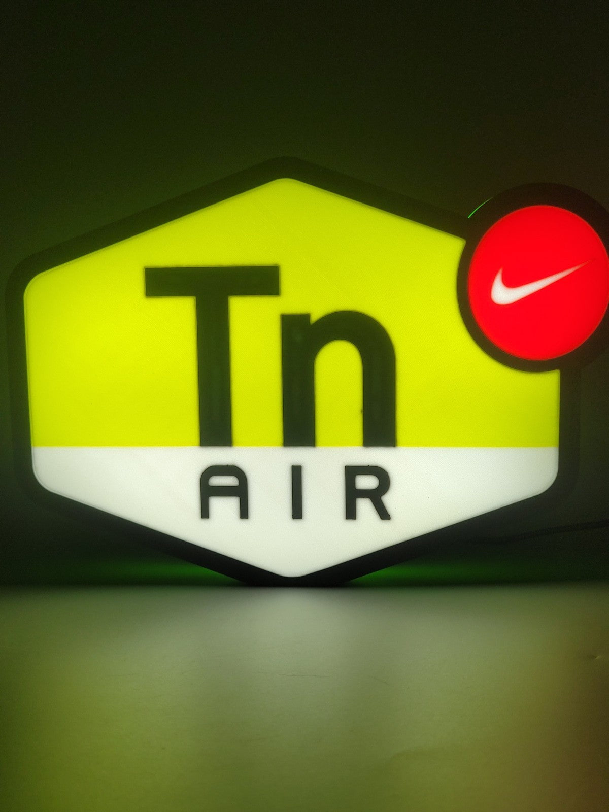 Nike TN LED light sign with illuminated logo viewed from straight on