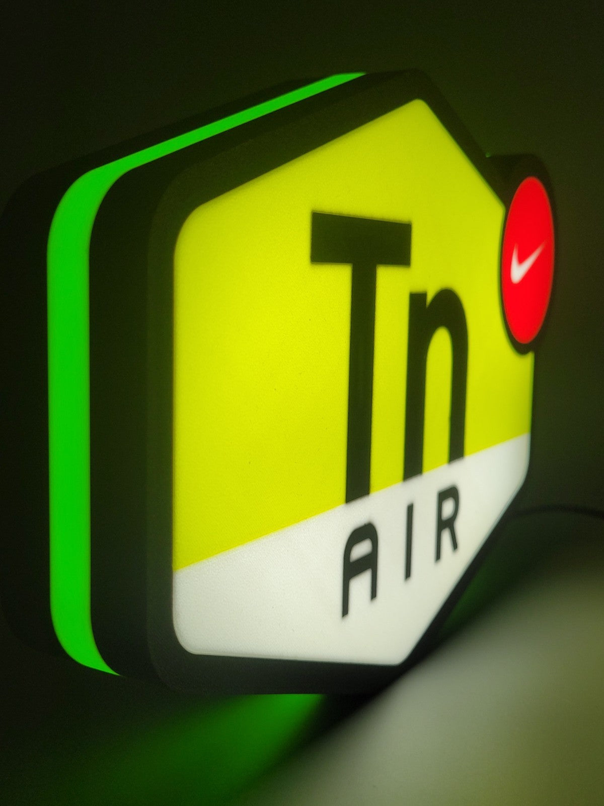 Nike TN LED light sign with illuminated logo viewed from side view